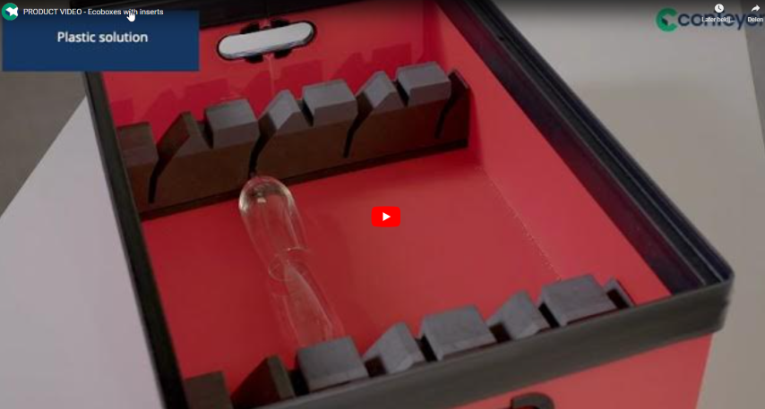 A red plastic box with black inserts for holding items, featuring a transparent glass tube inside and a video play button visible on the surface.