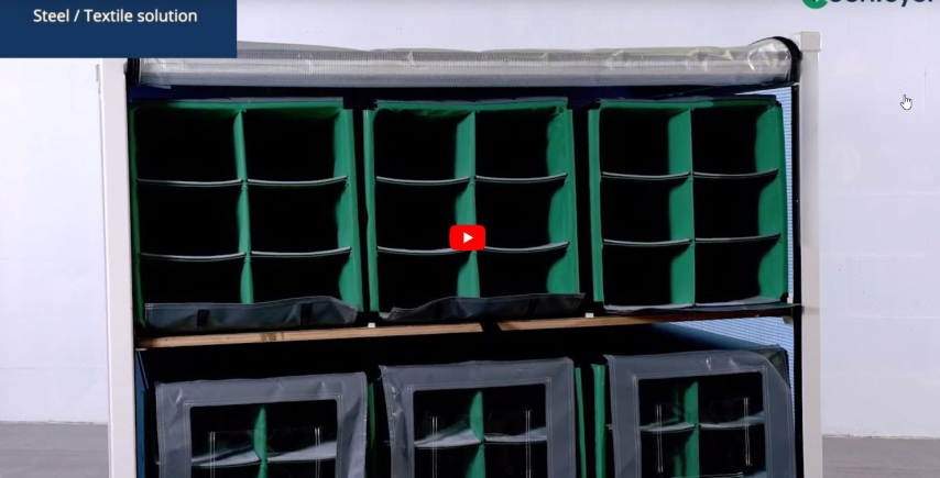 Storage solution featuring green fabric compartments organized within a steel framework, with a video play button overlay.