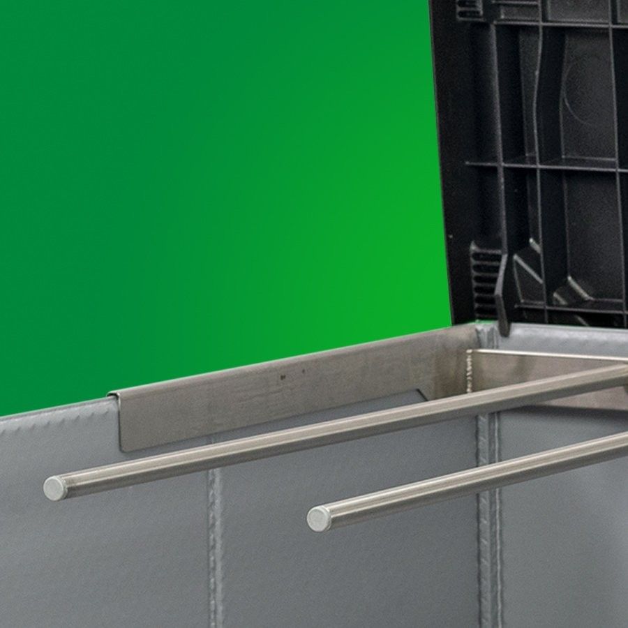 Metal rods inside a container with a green background.