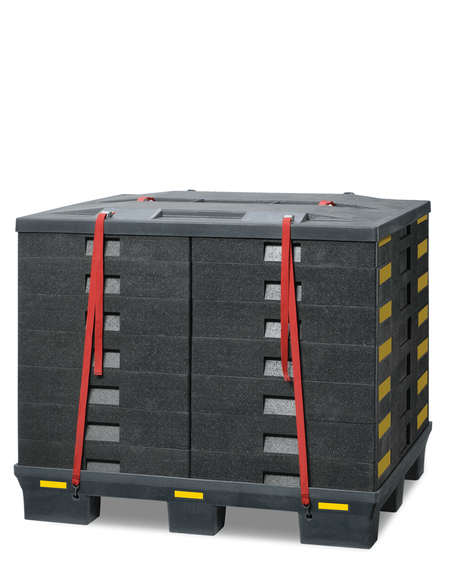 A stack of rectangular foam blocks secured with red straps on a black pallet.