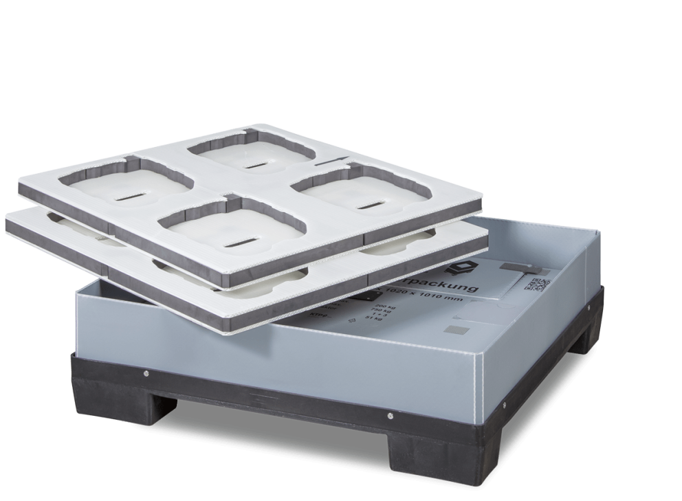 Stacked plastic pallet with two trays on top, featuring compartments for storage, against a transparent background.
