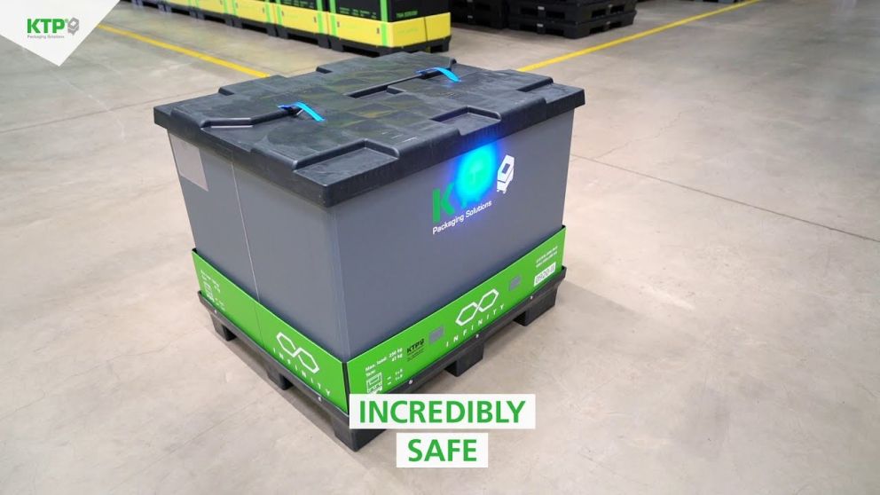 A gray storage container with green accents labeled "KTP Packaging Solutions" and a glowing blue light, set in a warehouse environment with the text "INCREDIBLY SAFE" overlaying the image.