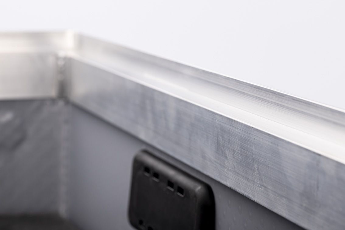 A detail shot of a blue conTeyor Ecobox with black details