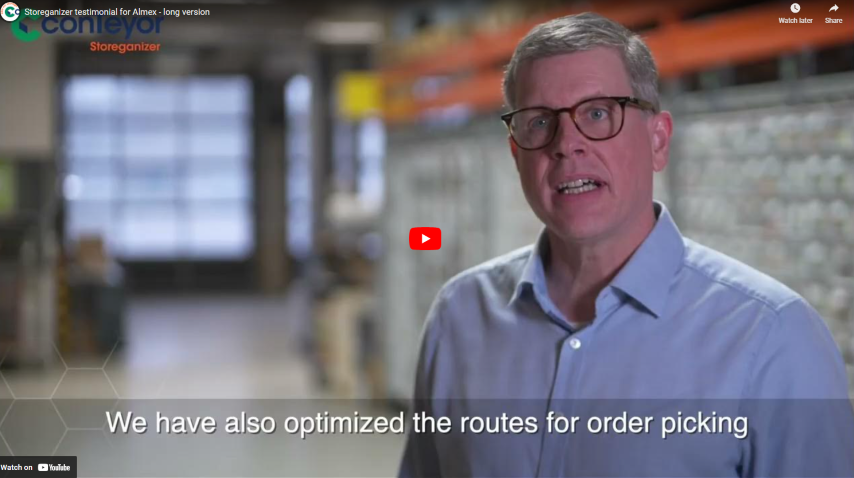 A person speaking in a warehouse environment about optimizing order picking routes, with a video play button overlay.