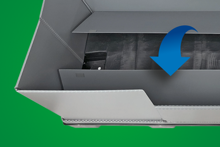 Close-up view of a grey storage box with a highlighted section and a downward arrow, set against a green background.