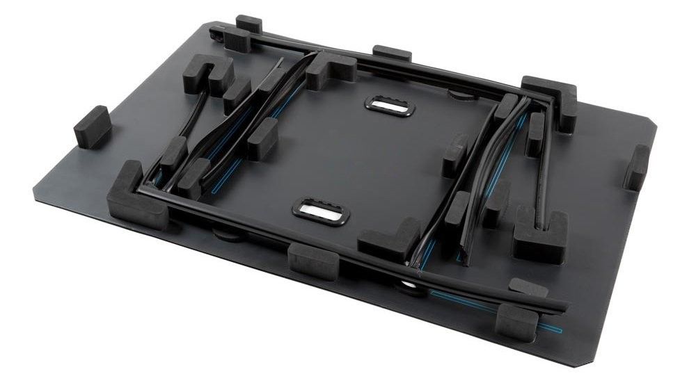 A black storage tray with various cutouts and rubber grips, designed for organizing tools or equipment.