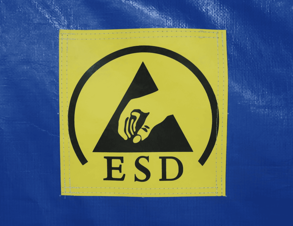 A close up of a yellow danger sign with the letters "ESD" on it.