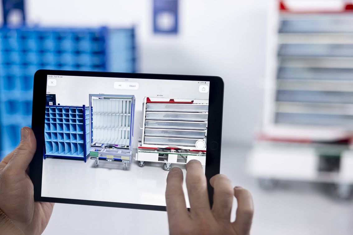 A person holding a tablet while operating the Nestimator software