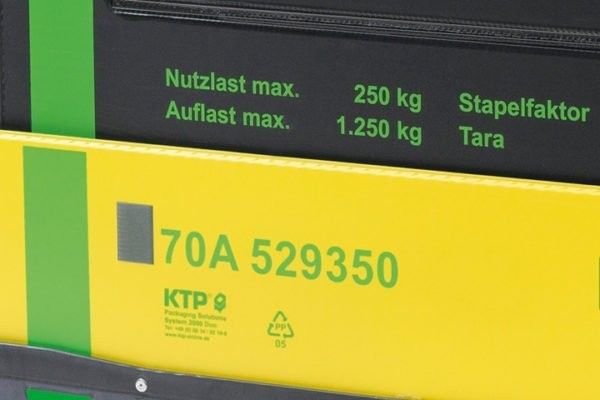 Label on packaging showing weight capacity and identification number, with green text on a black and yellow background.
