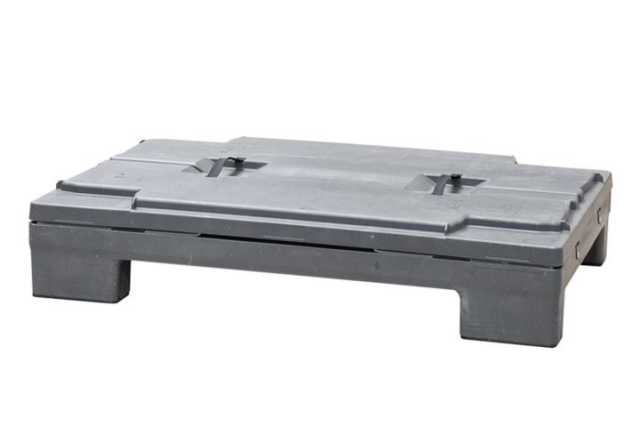 Black plastic pallet with a flat surface and fork openings for handling.