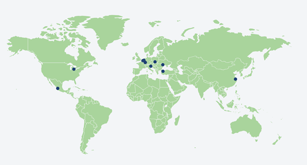World map with light green landmasses and dark blue dots indicating specific locations.