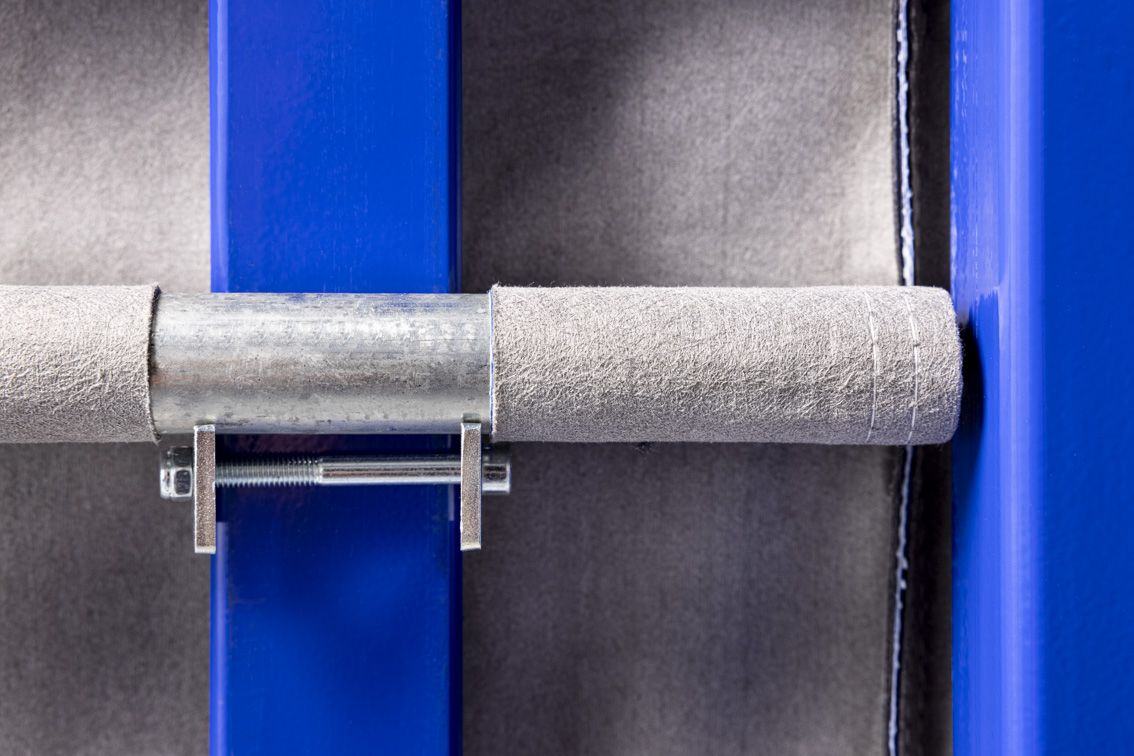 A close-up of a blue modular rack with textile inserts