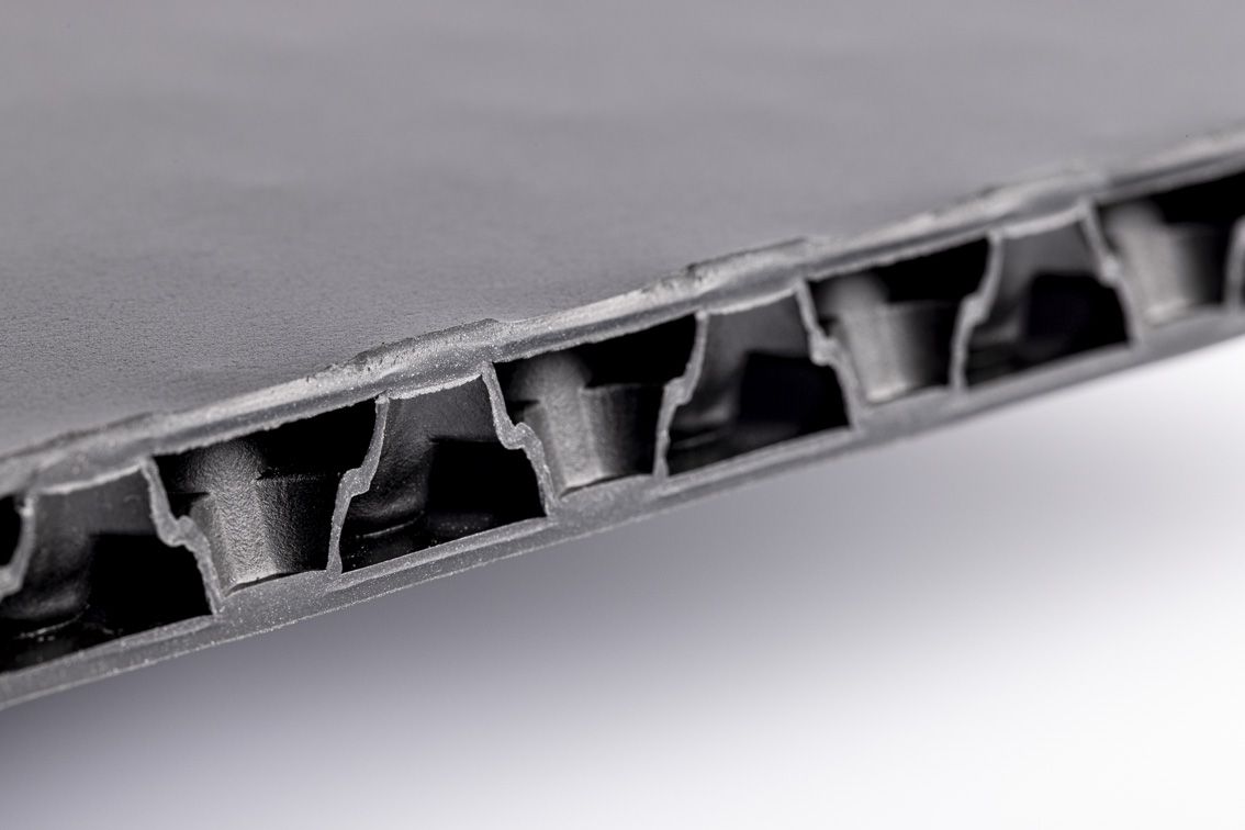 A detail shot of a blue conTeyor Ecobox with black details