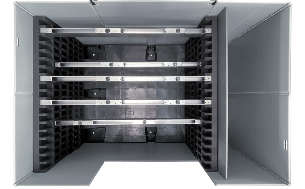 A top-down view of a large, gray industrial storage container with metal horizontal racks and a textured interior for holding items securely.