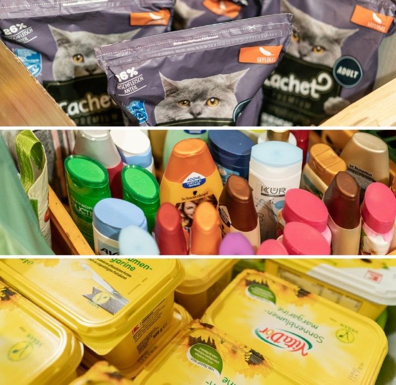 Three stacked sections of various products: the top section shows bags of cat food, the middle section features assorted shampoo and body care bottles, and the bottom section displays containers of margarine.